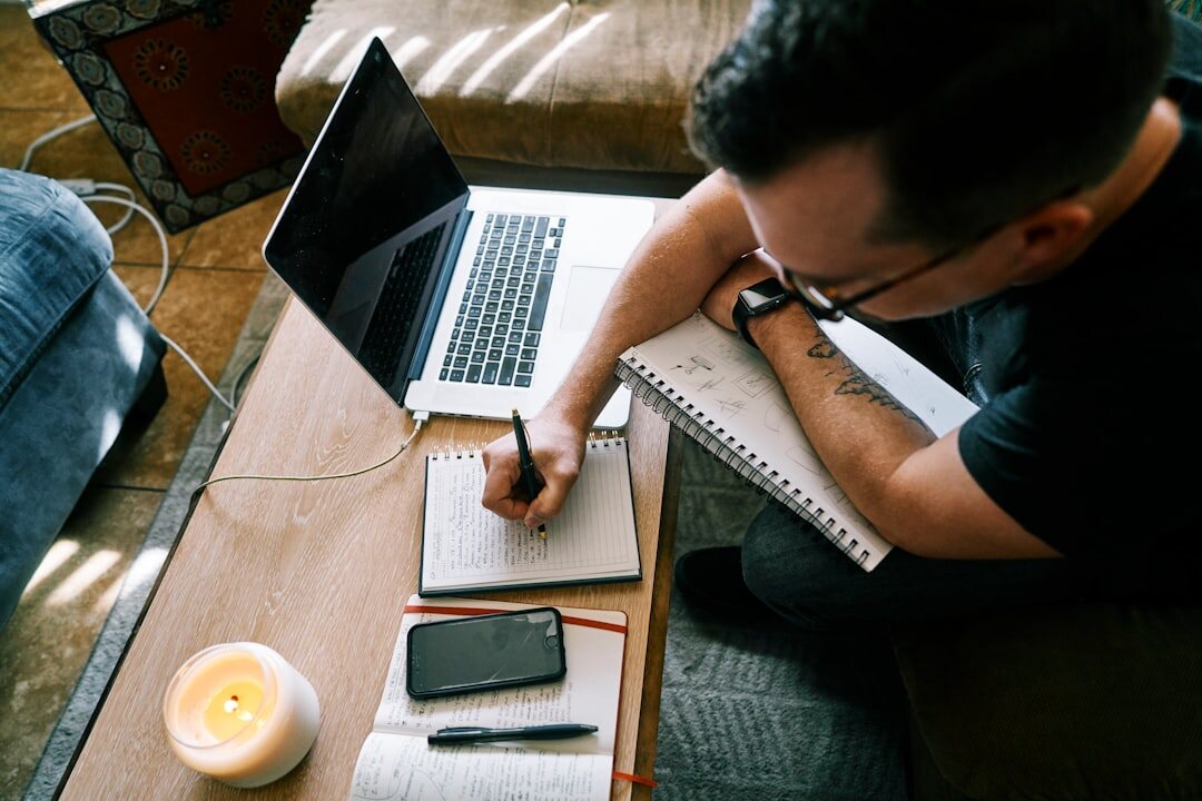 writer at desk with notes